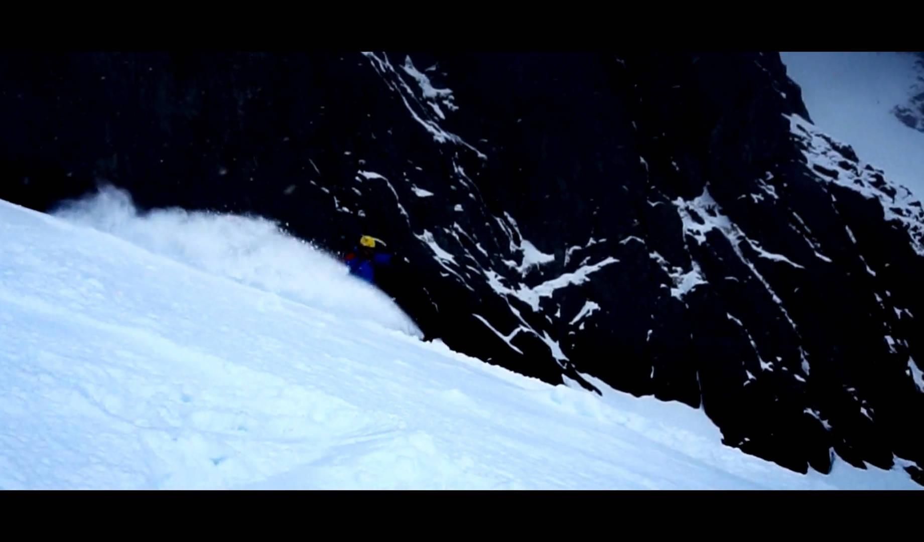Splitboarder in front of a wall Nice spray