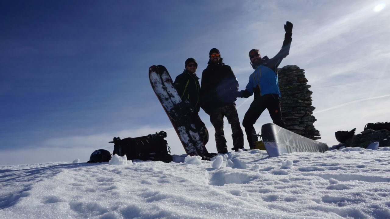 Summit Joy Splitboarding at Arlberg 3 guys on top of a mountain